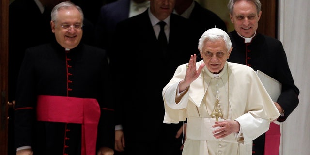 Dec. 5, 2012 - Pope Benedict XVI arrives for his weekly general audience followed by his personal secretary Georg Gaenswein, background right, and father Leonardo Sapienza, regent of the Prefecture of the Pontifical Household.