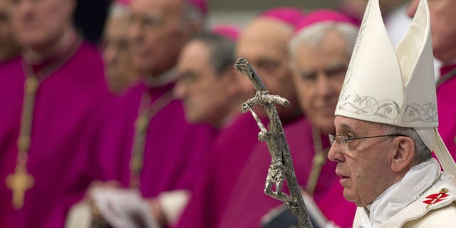January 1, 2014: Pope Francis arrives to celebrate a Mass in St. Peter's Basilica at the Vatican. (AP Photo/Andrew Medichini)