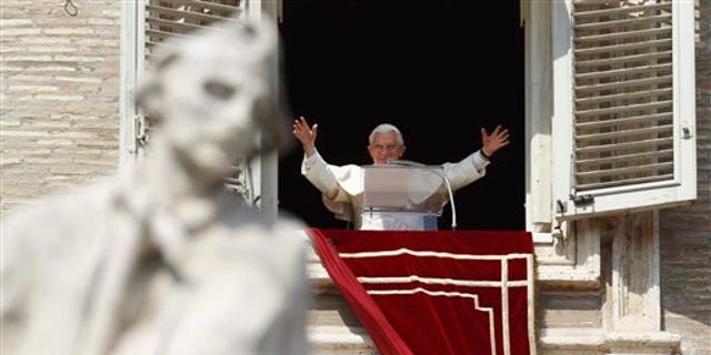 March 18: Pope Benedict XVI greets faithful during the Angelus prayer from his studio window overlooking St. Peter's Square at the Vatican. Pope Benedict XVI has asked for prayers for his upcoming trip to Mexico and Cuba.
