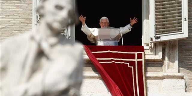 March 18: Pope Benedict XVI greets faithful during the Angelus prayer from his studio window overlooking St. Peter's Square at the Vatican. Pope Benedict XVI has asked for prayers for his upcoming trip to Mexico and Cuba.