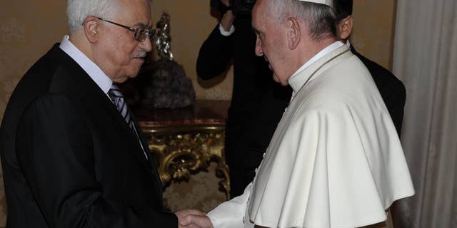 Oct. 17, 2013 - Pope Francis shakes hands with Mahmoud Abbas, President of the Palestinian Authority, during their private audience at the Vatican.