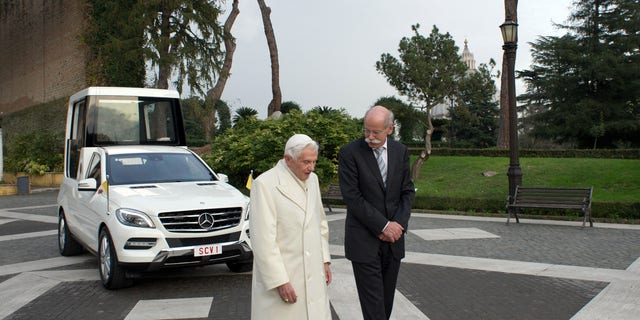 Dec. 7, 2012 - Pope Benedict XVI and Mercedes Benz CEO Dieter Zetsche walk past the new popemobile presented to the Pontiff at the Vatican.