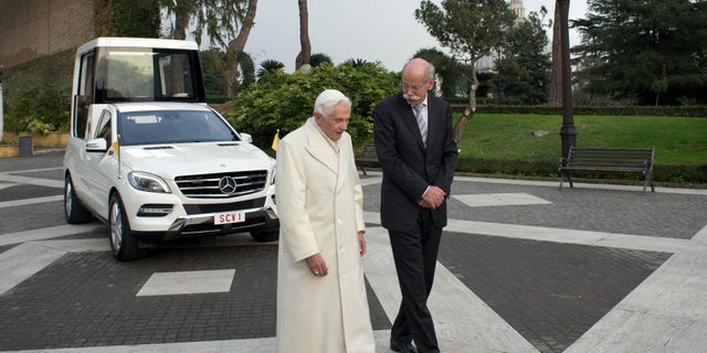 Dec. 7, 2012 - Pope Benedict XVI and Mercedes Benz CEO Dieter Zetsche walk past the new popemobile presented to the Pontiff at the Vatican.