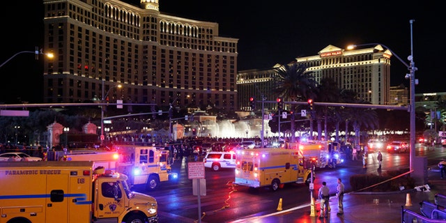 Police and emergency crews respond to the scene of a car accident along Las Vegas Boulevard, Sunday, Dec. 20, 2015, in Las Vegas. (AP Photo/John Locher)