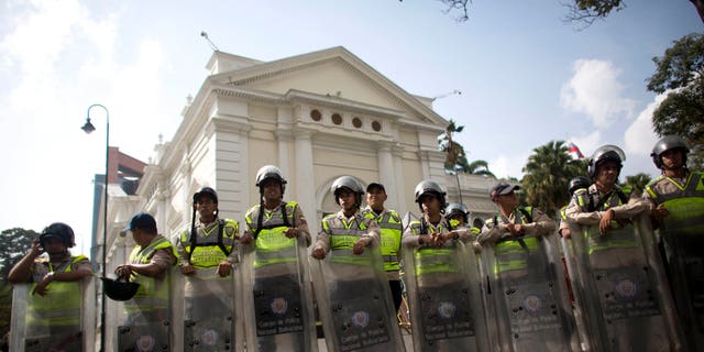 National Bolivarian Police officers outside the National Assembly building in Caracas, Venezuela, Tuesday, March. 1, 2016.