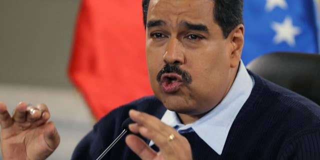 FILE - In this Aug. 24, 2015 file photo, Venezuela's President Nicolas Maduro gives a news conference at Miraflores presidential palace in Caracas, Venezuela. On Sunday, Oct. 18, 2015, Maduro called for prosecution of Lorenzo Mendoza, Venezuela’s biggest businessman, president of the Empresas Polar conglomerate, for allegedly conspiring to destabilize his government. (AP Photo/Fernando Llano, File)