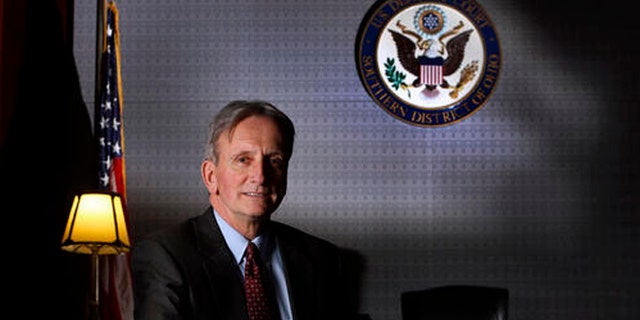 FILE - In this Jan. 6, 2015, file photo, Chief Judge Edmund Sargus of the U.S. District Court's Southern District of Ohio poses for a photo in Columbus, Ohio. In a Friday, July 22, 2016, ruling, Sargus of the U.S. District Court's Southern District of Ohio rejected a $100 million investors' lawsuit against Venezuela over three-decade old promissory notes issued by a now-defunct government-sponsored Venezuelan bank, in a case that included allegations of fraud, hints of an international criminal conspiracy and references to diamonds, junk bonds and a house fire in Switzerland. (Eric Albrecht/The Columbus Dispatch via AP, File)
