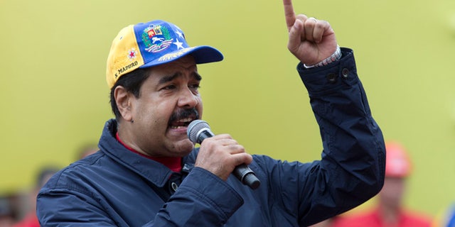 Venezuela's President Nicolas Maduro speaks during a May Day march in Caracas, Venezuela, Sunday, May 1, 2016.