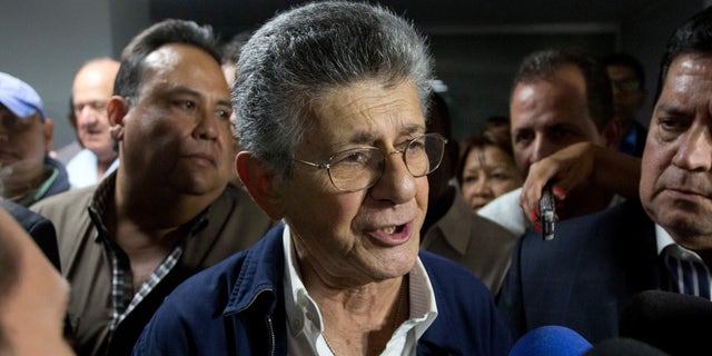 Congressmen Henry Ramos Allup speaks with media after he was elected as the Venezuela National Assembly's President in Caracas, Venezuela, Sunday, Jan. 3, 2016. Newly-elected opposition lawmakers voted in Ramos as National Assembly president Sunday. (AP Photo/Fernando Llano)