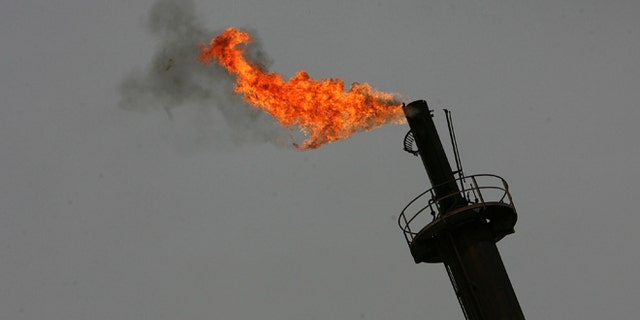 BAGHDAD, IRAQ - NOVEMBER 5: The Daura oil refinery is seen on November 5, 2009 in Baghdad, Iraq. Iraq and a grouping of U.S and European oil companies Exxon Mobil Corp and Royal Dutch Shell PLC signed a $50 billion contract today to develop the West Qurna oilfield, two days after the Iraqi South Oil Company signed a technical service contract with Britain's BP and China's CNPC to develop the Rumaila oilfield. The Iraqi government is trying to attract foreign investment, especially in the oil sector, in hopes of reviving its war-torn economy. Iraq has the third largest oil reserve in the world but it is producing way below its potential. (Photo by Muhannad Fala'ah/Getty Images)