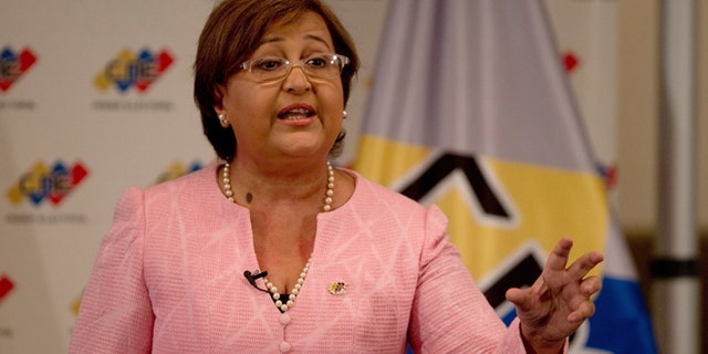 National Elections Council President Tibisay Lucena speaks during a televised nation wide speech, from her office in Caracas, Venezuela, Tuesday, Aug. 9, 2016. Venezuelan elections officials have set an October date for a recall drive against President Nicolas Maduro. (AP Photo/Fernando Llano)
