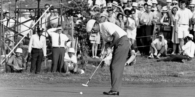 June 20, 1964: This file photo shows Ken Venturi making the final putt on the 18th green during the U.S. Open Golf Championship at Congressional Country Club in Bethesda, Md.