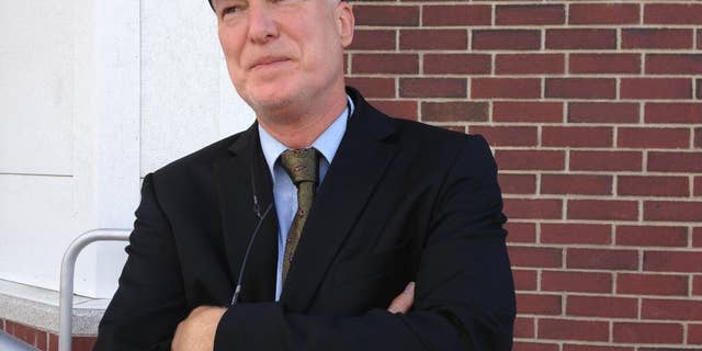 Washington County State's Attorney Scott Williams stands near where Vermont social worker Lara Sobel was shot and killed outside a state office building in Barre on Friday Aug. 21, 2015. Williams, who took the rifle away from the alleged shooter and tended to Sobel, revisits the parking lot to grieve. Williams turned the prosecution of the case over to the office of the Vermont Attorney General. Suspect Jody Herring has pleaded not guilty in the killing of Sobel. She's due in court Aug. 25 to answer charges she also killed three relatives. (AP Photo/Lisa Rathke)