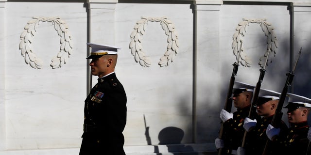 Nov. 11: The U.S. Marine Corps Honor Guard stands during the wreath ceremony at the Tomb of the Unknowns in honor of Veterans' Day at Arlington National Cemetery in Arlington, Va.