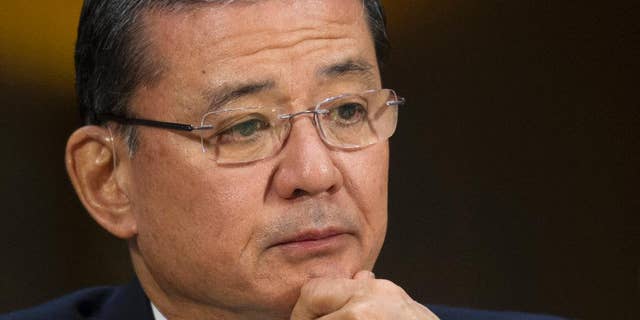 FILE - This May 15, 2014 file photo shows Veterans Affairs Secretary Eric Shinseki testifying on Capitol Hill in Washington. Veterans at the Phoenix veterans hospital waited on average 115 days for their first medical appointment _ 91 days longer than the hospital reported, the Veterans Affairs Department’s inspector general said Wednesday. Rep. Jeff Miller, R-Fla., chairman of the House Veterans Affairs Committee, and Sen. John McCain, R-Ariz., immediately called for VA Secretary Eric Shinseki to resign. Miller also said Attorney General Eric Holder should launch a criminal investigation into the VA. (AP Photo/Cliff Owen, File)