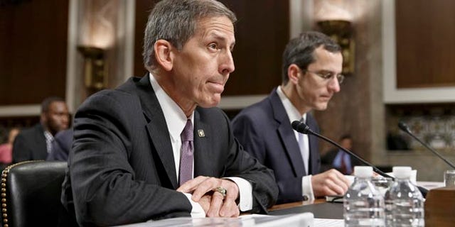 Veterans Affairs acting Secretary Sloan Gibson testifies on Capitol Hill in Washington, Wednesday, July 16, 2014, before the Senate Veterans' Affairs Committee hearing on the state of VA health care in the wake of revelations of neglect and delayed medical visits. He is accompanied by Assistant Deputy Undersecretary For Health For Administrative Operations Philip Matkowsky.