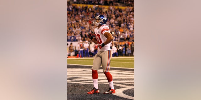 INDIANAPOLIS, IN - FEBRUARY 05: Victor Cruz #80 of the New York Giants celebrates in the end zone after catching a two yard touchdown pass from Eli Manning #10 in the first quarter against the New England Patriots during Super Bowl XLVI at Lucas Oil Stadium on February 5, 2012 in Indianapolis, Indiana. (Photo by Jamie Squire/Getty Images) *** Local Caption *** Victor Cruz