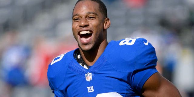 Sep 15, 2013; East Rutherford, NJ, USA; New York Giants wide receiver Victor Cruz (80) smiles before the game against the Denver Broncos at MetLife Stadium. Mandatory Credit: Robert Deutsch-USA TODAY Sports
