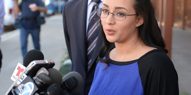 In this Monday, Jan. 20, 2014 photo, a woman who wanted to be identified by her first name, Jamie, speaks at a news conference in front of Alhambra High School in Alhambra, Calif., where Andrea Cardosa last worked as vice principal of student services. Police in Riverside, Calif., are investigating allegations from her and another woman, who say Cardosa, a former middle school teacher and administrator, abused them while they were students in Riverside County. (AP Photo/The Pasadena Star-News, Keith Durflinger) MAGS OUT; NO SALES; MANDATORY CREDIT