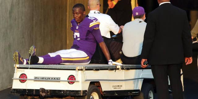 FILE - In this Sunday, Sept. 28, 2014, file photo, Minnesota Vikings quarterback Teddy Bridgewater is taken off the field on a cart after getting injured in the second half of an NFL football game against the Atlanta Falcons in Minneapolis. Bridgewater's first start for the Minnesota Vikings couldn't have been better, except of course for the sprained left ankle in the fourth quarter that forced him out of the 41-28 victory over Atlanta. (AP Photo/Jim Mone, File)