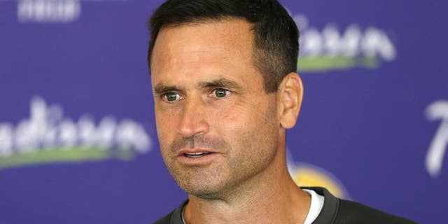 FILE - In this July 27, 2013 file photo, Minnesota Vikings special teams coordinator Mike Priefer speaks to reporters following practice at NFL football training camp in Mankato, Minn. Once again, the Vikings are reporting to training camp with some sort of swirling controversy or off-the-field distraction to address. This time, it's the lawsuit brought by former punter Chris Kluwe over alleged discrimination, following a six-month investigation that resulted in a three-game suspension of Priefer for an anti-gay remark. (AP Photo/Charlie Neibergall, File)