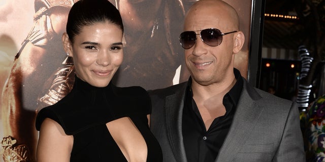 WESTWOOD, CA - AUGUST 28: Actor Vin Diesel (R) and model Paloma Jimenez attend the premiere of Universal Pictures' "Riddick" at Mann Village Theatre on August 28, 2013 in Westwood, California. (Photo by Kevin Winter/Getty Images)