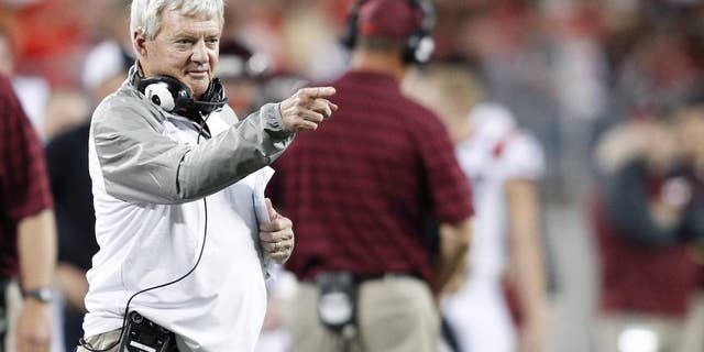 Virginia Tech head coach Frank Beamer points at his quarterback during second quarter of an NCAA college football game Saturday, Sept. 6, 2014, in Columbus, Ohio. Virginia Tech Beat Ohio State 35-21. (AP Photo/Paul Vernon)