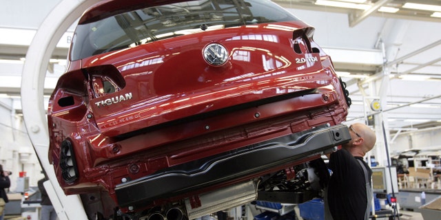 WOLFSBURG, GERMANY - FEBRUARY 15: Workers assemble Tiguan cars at the production line at the Volkswagen factory February 15, 2008 in Wolfsburg, Germany. The Tiguan and the Touran are assembled by the workers of the Auto 5000 GmbH, a Volkwagen AG subcompany. (Photo by Krafft Angerer/Getty Images)