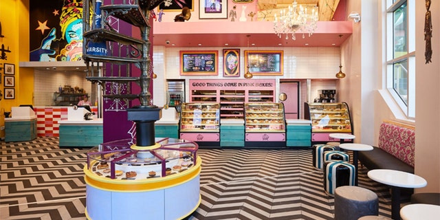 The new shop features Voodoo’s signature eclectic look, including bright pink accents and a black and white zig zag-patterned floor.