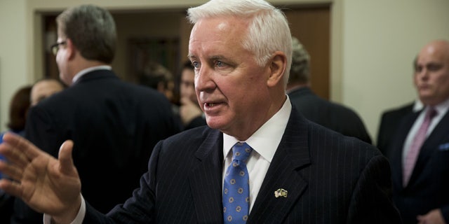 Jan. 17, 2014: Gov. Tom Corbett gestures as he responds to a question during a news conference.