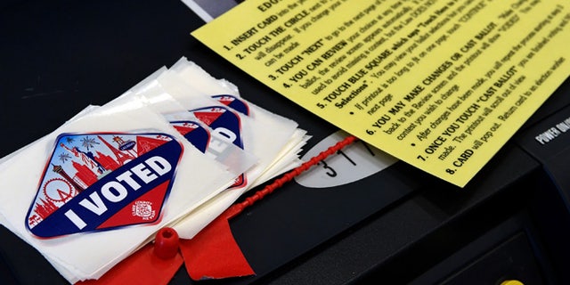 LAS VEGAS, NV - NOVEMBER 08: Las Vegas Strip-themed "I Voted" stickers are stacked next to a voting instruction card on the back of a voting machine at a polling station at John W. Bonner Elementary School on Election Day on November 8, 2016 in Las Vegas, Nevada. Americans across the nation are picking their choice for the next president of the United States. (Photo by Ethan Miller/Getty Images)