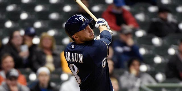 Monday, April 20: Milwaukee Brewers right fielder Ryan Braun hits a solo home run in the ninth inning against the Cincinnati Reds at Miller Park. The Brewers lost 6-1.