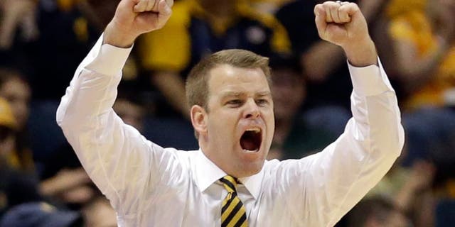 Marquette head coach Steve Wojciechowski shouts during the second half of an NCAA college basketball game against Morgan State Sunday, Dec. 28, 2014, in Milwaukee. (AP Photo/Aaron Gash)