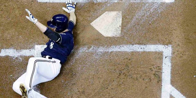 Tuesday, Sept. 1: The Milwaukee Brewers' Ryan Braun slides safely home during the first inning against the Pittsburgh Pirates in Milwaukee. Braun scored from first on a double by Adam Lind.
