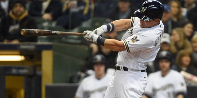 Monday, April 4: Milwaukee Brewers second baseman Scooter Gennett hits a solo home run in the second inning against the San Francisco Giants at Miller Park in Milwaukee.