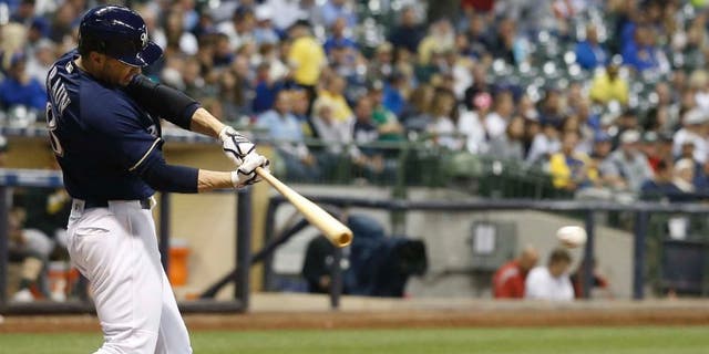Tuesday, June 7: The Milwaukee Brewers' Ryan Braun hits a single for his 1,500th career hit during the sixth inning against the Oakland Athletics in Milwaukee. The Brewers won 5-4.