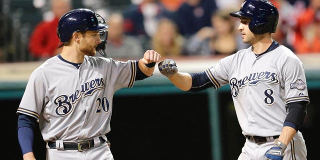 Tuesday, Aug. 25: The Milwaukee Brewers' Ryan Braun (right) is congratulated by Jonathan Lucroy after Braun hit a two-run home run off Cleveland Indians starting pitcher Josh Tomlin in the sixth inning in Cleveland.