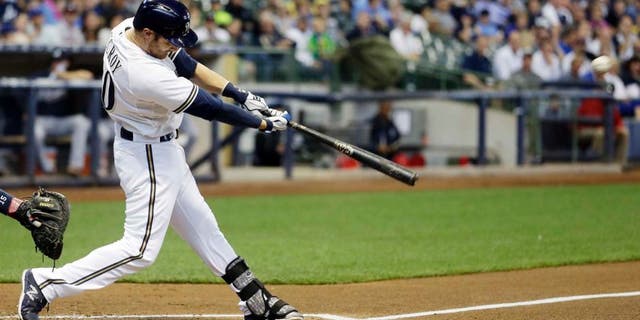 Tuesday, July 7: The Milwaukee Brewers' Jonathan Lucroy hits a home run during the first inning against the Atlanta Braves in Milwaukee.