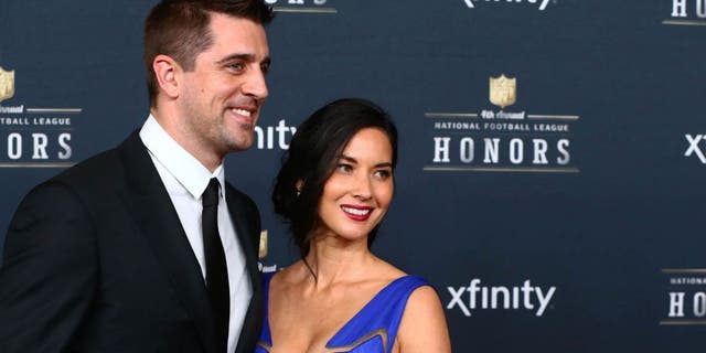 Saturday, January 31: Green Bay Packers quarterback Aaron Rodgers and girlfriend actress Olivia Munn pose on the red carpet prior to the NFL Honors award ceremony at Symphony Hall in Phoenix, where Rodgers was selected the AP Most Valuable Player.