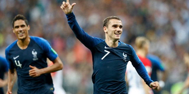 France's Antoine Griezmann celebrates after scoring on a penalty his side' second goal during the final match between France and Croatia at the 2018 soccer World Cup in the Luzhniki Stadium in Moscow, Russia, Sunday, July 15, 2018. (AP Photo/Matthias Schrader)