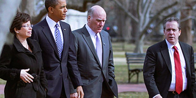 Monday: President Obama is surrounded by Senior adviser Valerie Jarrett, Chief of Staff Bill Daley and National Economic Council Director Gene Sperling while walking back to the White House from the U.S. Chamber of Commerce.
