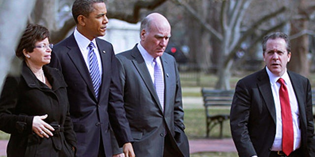 Monday: President Obama is surrounded by Senior adviser Valerie Jarrett, Chief of Staff Bill Daley and National Economic Council Director Gene Sperling while walking back to the White House from the U.S. Chamber of Commerce.