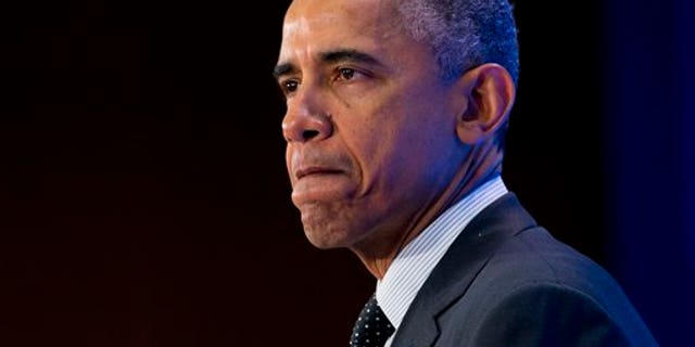 President Barack Obama pauses while speaking at the Countering Violent Extremism (CVE) Summit, Thursday, Feb. 19, 2015, at the State Department in Washington. (AP Photo/Carolyn Kaster)