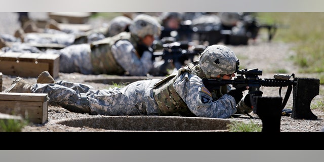 Female soldiers from 1st Brigade Combat Team, 101st Airborne Division, train on a firing range in Fort Campbell, Kentucky, in preparation for their deployment to Afghanistan, Sept. 18, 2021.