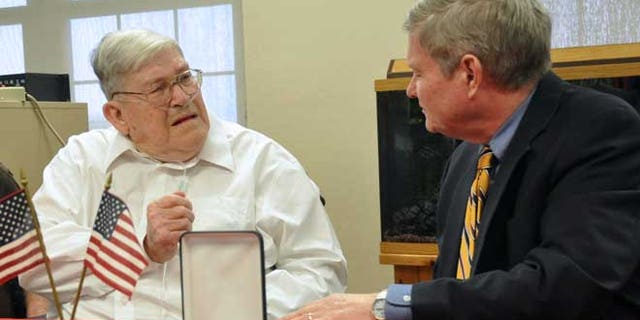May 1, 2013: World War II veteran Charles Bledsoe, 88, left, talks with U.S. Sen. Tim Johnson, D-S.D., as he's awarded a Purple Heart and Bronze Star for injuries sustained in combat  at the Veterans Administration hospital in Sioux Falls, S.D.