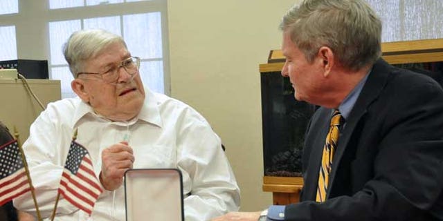 May 1, 2013: World War II veteran Charles Bledsoe, 88, left, talks with U.S. Sen. Tim Johnson, D-S.D., as he's awarded a Purple Heart and Bronze Star for injuries sustained in combat at the Veterans Administration hospital in Sioux Falls, S.D.