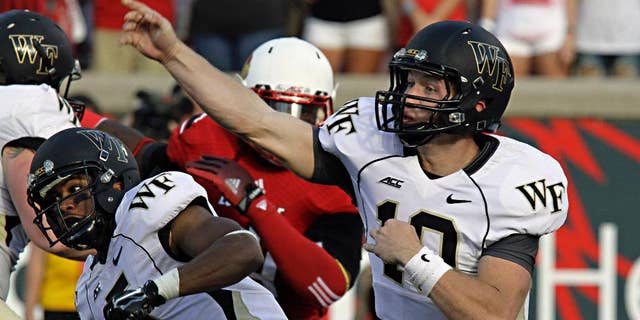 Wake Forest quarterback John Wolford launches a pass attempt against Louisville in their NCAA college football game in Louisville, Ky., Saturday, Sept. 27, 2014. Wolford completed 19 of 34 passes and threw three interceptions in the 20-10 Louisville victory. (AP Photo/Garry Jones)