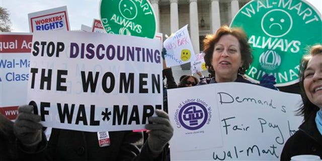March 30: Protestors rally outside the Supreme Court in Washington, supporting plaintiffs in a case of women employees against Walmart.