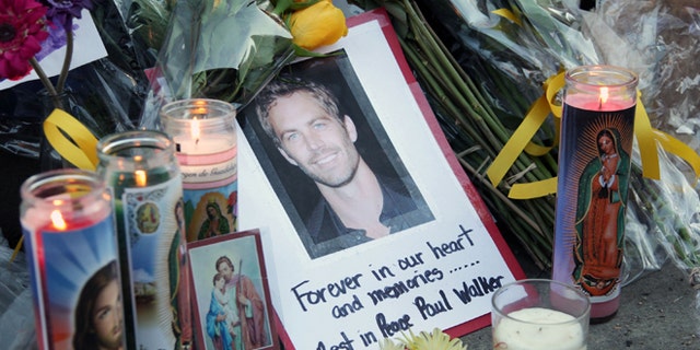 VALENCIA, CA - DECEMBER 01:  A general view of atmosphere as fans pay tribute to actor Paul Walker at the site of his fatal car accident on December 1, 2013 in Valencia, California.  Walker died on November 30, 2013 at age 40. (Photo by David Buchan/Getty Images)