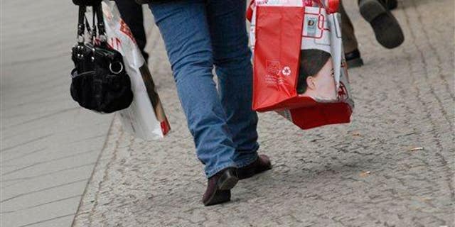 A woman carries shopping bags in Berlin, Germany.